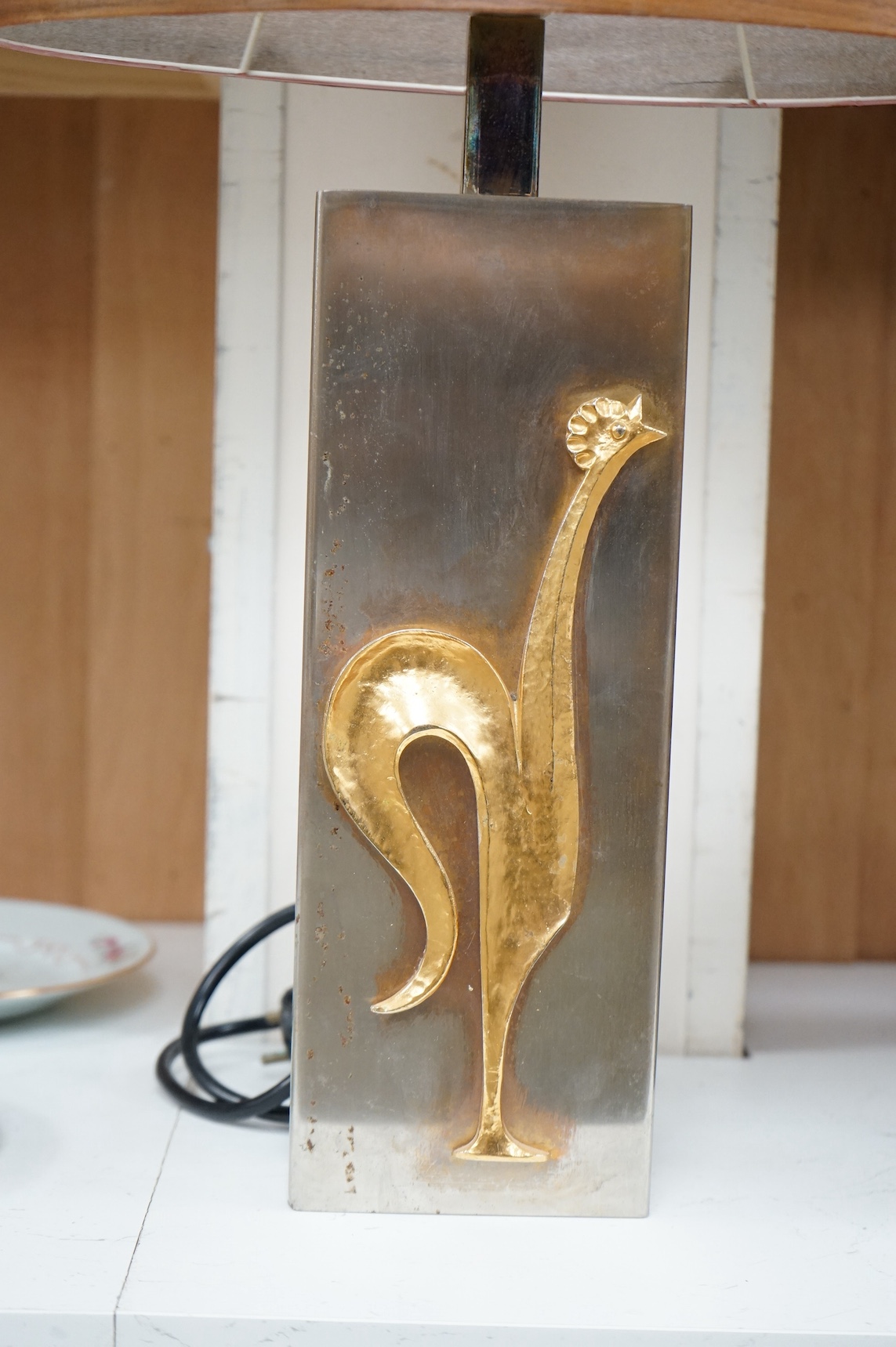 A mid century Maison Charles gilt brass overlaid ‘cockerel’ table lamp with shade, 58cm total height. Condition - fair, shade split, not tested